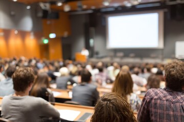 lecture hall for training, meeting room full of people or students participating in business training, seminar. High quality