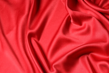 Obraz premium Beautiful red velvet curtain with folds as background