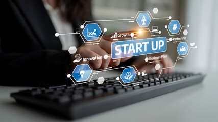 A business professional engaged with modern startup concepts, showcasing digital tools for innovation and growth, highlighting essential strategies for success. Tessel
