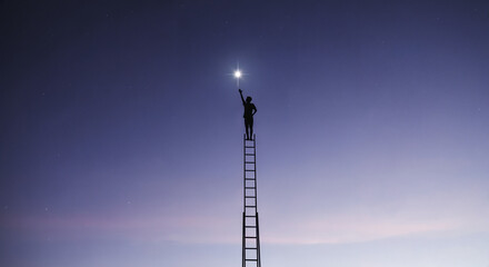 Obraz premium Silhouette of Man on Ladder Reaching for Bright Star in Night Sky