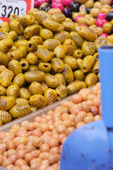 Colorful display of olives at a market in springtime