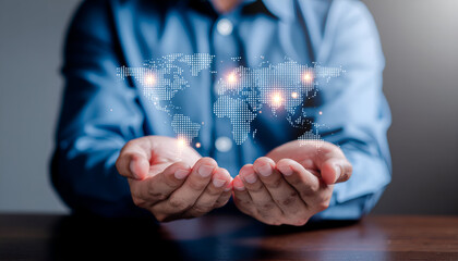 Human hands supporting a holographic world map with bright nodes, illustrating worldwide communication and tech networks.