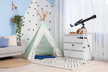 Children's playroom interior with telescope, teepee tent, and sofa for imaginative learning and relaxation © Pixel-Shot