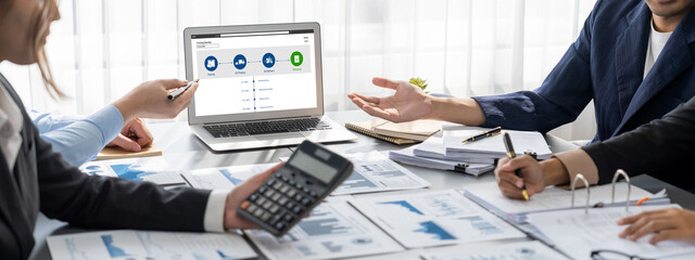 Business intelligence and data analysis concept. Analyst team working on financial data analysis dashboard on laptop screen as marketing indication for effective business strategic planning. Insight