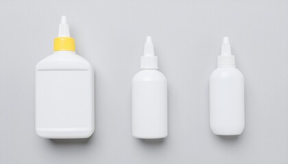 Three White Glue Bottles, Different Sizes, Minimalist Composition, Studio Shot