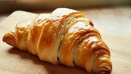 Freshly baked golden croissants close up with steam. Artisan bakery. Homemade Bakery. Comfort Food Concept. Culinary clip, reels, video content.