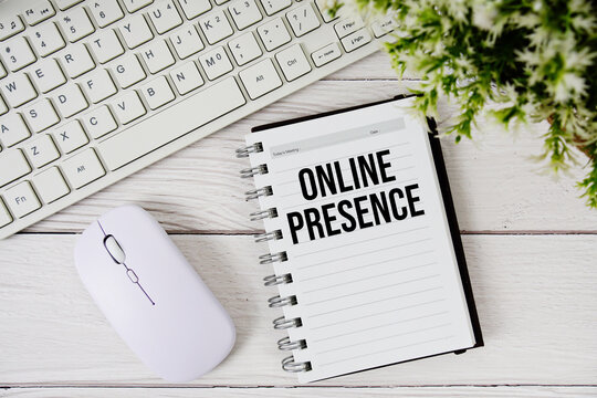 Online Presence text with keyboard and wireless mouse on wooden background