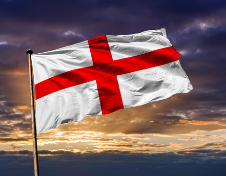 St George's Cross Flag of England Waving Proudly Against a Cloudy Sunset Sky