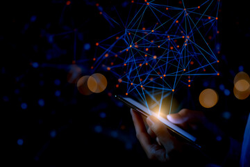A hand holds a smartphone, illuminated by digital connections and glowing nodes, set against a dark background, symbolizing technology and communication.