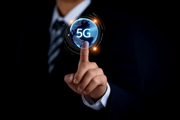 A businessman interacts with a digital 5G icon, symbolizing advanced technology and connectivity in a modern world.
