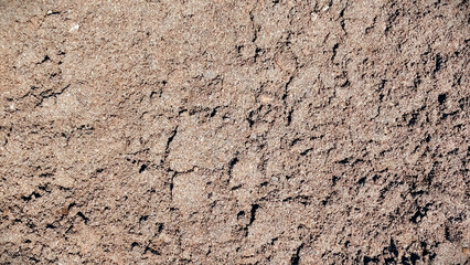 Soft dry soil texture with smooth earth surface and natural terrain detail suitable for backgrounds and design applications