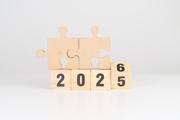 2025 year change to 2026 year block with jigsaw puzzle icon. Business Process, Team, teamwork,...
