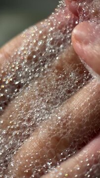 Hand foam texture footage video micro lens details for advertising content