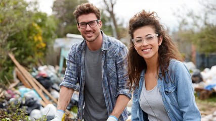 Happy Couple Volunteering for Community Clean-up, Smiling at Camera
