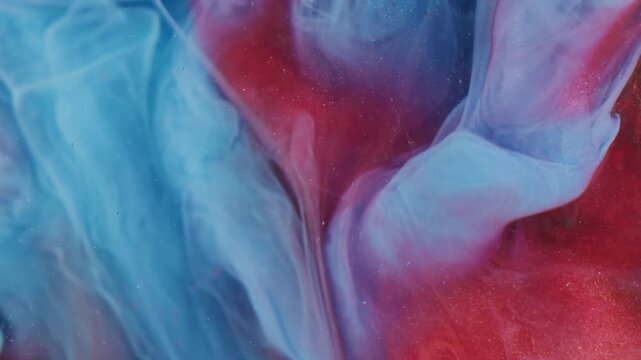 Paint blend. Color mix. Defocused blue red glitter smoke drop flow on brown wood bark surface underwater abstract art background.