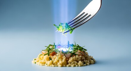 Fork lifting greens from couscous shrimp