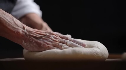 Hands of baker kneading dough, focused on a culinary process Stock Video
