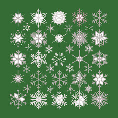Decorative pattern of white and gray snowflakes falling gently against a deep forest green color, symbolizing winter and the christmas season