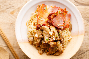 Egg Noodles with meat in bowl with chopsticks