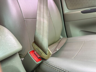 Car Seatbelt and Buckle Close-Up on Leather Seat