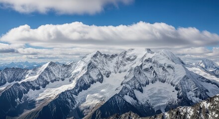 Majestic snowcapped mountain range under a dramatic cloudy sky, showcasing rugged peaks and glaciers
