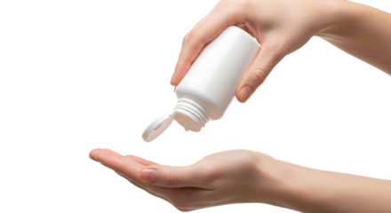 Hand pouring white pills from bottle into palm for daily dosage