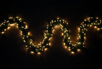 A close-up of a fragment of a glowing New Year's garland.