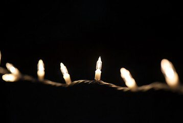 A close-up of a fragment of a glowing New Year's garland.