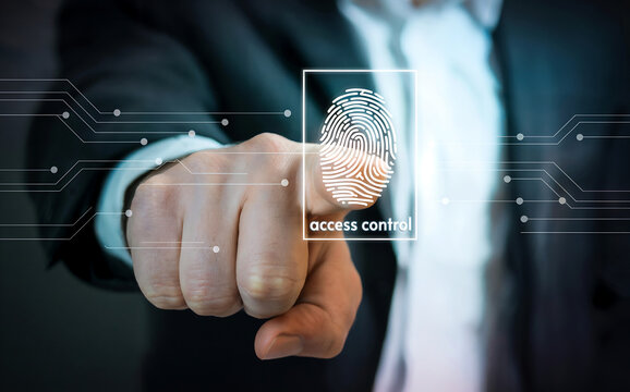 Closeup of a businessmans finger pressing on a screen displaying a fingerprint scan for access control and biometric authentication in a futuristic setting