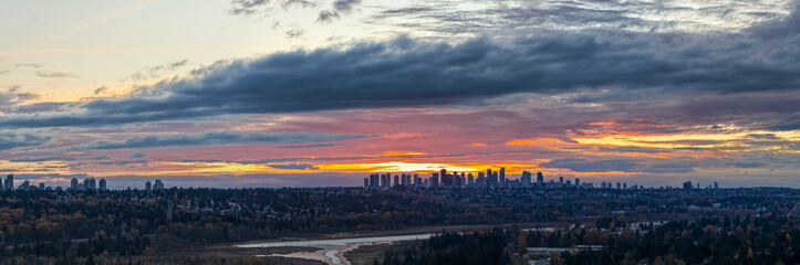 Sunset Over Burnaby Skyscrapers: Golden Sky Over the Greater Vancouver City Skyline at Dusk