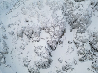 Aerial View Of Snowy Rocky Mountain Ridge In Winter Landscape, BC, Canada
