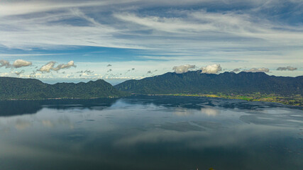 Blue lake Maninjau in a crater among the mountains. Sumatra, Indonesia.
