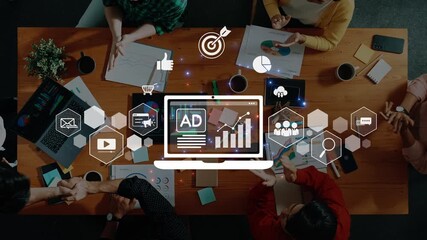 A diverse group of professionals engages in a dynamic meeting, surrounded by digital marketing graphics that highlight strategies, analytics, and business growth opportunities. Raster - Powered by Adobe