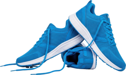 Two bright blue athletic sneakers with white soles and laces are arranged compositionally against a dark background showcasing mesh material and sporty design elements athletic shoes