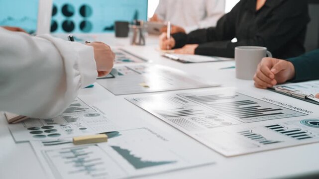 A dynamic business team collaborates in a modern office, analyzing financial reports and discussing strategies to drive performance and achieve growth objectives. SACTR