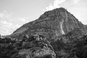 A black and white view of steep sandstone cliffs near Angel’s Landing highlights texture and dramatic canyon forms.