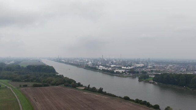 Ludwigshafen am Rhein, Germany, largest integrated chemical complex. production facilities, energy flows and logistics. Aerial drone video on cloudy day.