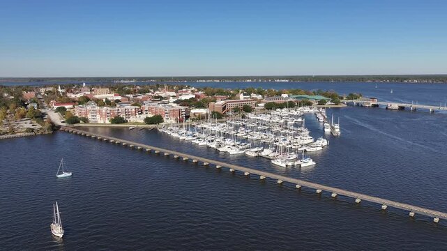 Aerial footage of Downtown New Bern NC, with river and marina