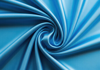 Swirling blue satin fabric creating a mesmerizing and luxurious texture, perfect for elegant backgrounds and designs
