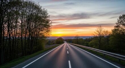 Fototapeta premium a road with a line of trees on both sides