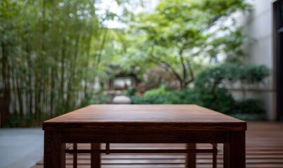 a Large square tablewooden table in the foreground, with an outdoor courtyard behind it.