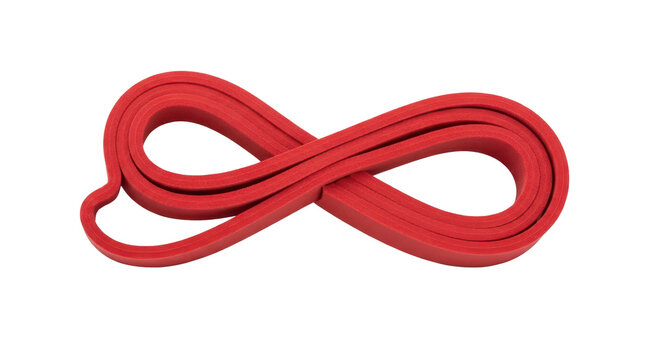 Red resistance exercise band coiled for fitness, workout, and physical therapy equipment isolated PNG with Transparent Background - Powered by Adobe