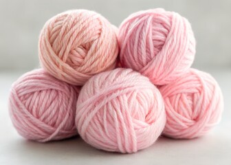 Close-up of multiple balls of pink yarn