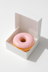 Soft pastel pink donut in an open white box, clean studio lighting and balanced shadows, perfect for minimal food and bakery design themes.
