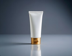 Elegant white tube with gold cap offers premium skincare or beauty product potential for branding mockups