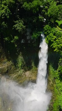 Immeasurable falls in Lake Sebu. Hikong Bente surrounded by lush green plants and trees. Mindanao, Philippines. Vertical view.