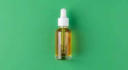 A small glass dropper bottle filled with golden liquid, positioned against a vibrant green background, suitable for skincare, health, or beauty product themes