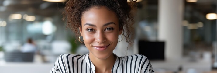 Smiling young african female professional in modern office setting