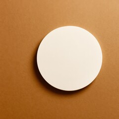 A white circle is on a tan background