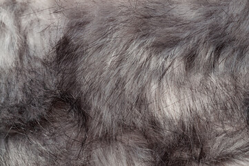 Close-up of luxurious faux fur texture in shades of gray and black
